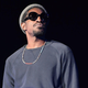 Image for article titled André 3000 just wandering the streets, playing the flute for delighted strangers
